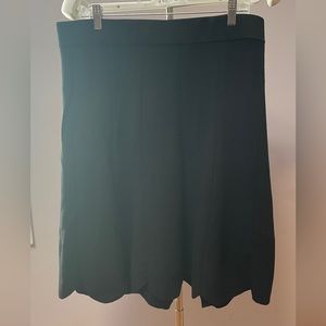 A-Line skirt with scalloped bottom. Hits right below a knee. Stretch waist, XL